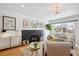 Cozy living room with a dark-bricked fireplace, modern decor, and a comfortable seating area at 3091 S Krameria St, Denver, CO 80222