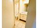 Bathroom with tile floors, single sink vanity, and standard toilet at 8826 E Florida Ave # 102, Denver, CO 80247