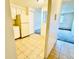 Kitchen with tile floors and white appliances at 8826 E Florida Ave # 102, Denver, CO 80247