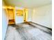 Living room with carpet flooring, white walls, and an open kitchen at 8826 E Florida Ave # 102, Denver, CO 80247