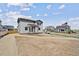 Exterior elevation of a two story home with a covered porch and driveway at 12353 E 101St Pl, Commerce City, CO 80022