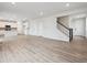 Large living room showcases a seamless open floor plan connecting the kitchen, dining, and living areas at 12353 E 101St Pl, Commerce City, CO 80022