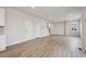 Spacious, naturally lit living room showcasing a light color palette and modern wood floors at 12353 E 101St Pl, Commerce City, CO 80022
