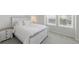 Light and airy bedroom with a queen-size bed, neutral colors, and two large windows for bright natural light at 1673 Morningview Ln, Castle Rock, CO 80109