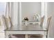 Dining room features a table with seating and sheer curtains, with natural light at 1673 Morningview Ln, Castle Rock, CO 80109