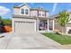 Charming two-story home with a well-manicured lawn and an attached two-car garage at 1673 Morningview Ln, Castle Rock, CO 80109