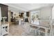 Open kitchen and dining area featuring a large island, dark cabinetry, and modern appliances at 1673 Morningview Ln, Castle Rock, CO 80109