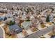 An aerial view shows a neighborhood with neatly arranged houses and well-maintained streets in a suburban community at 18338 E Powers Pl, Centennial, CO 80015