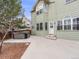 Two story home backyard view with hot tub at 18338 E Powers Pl, Centennial, CO 80015