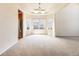 Bright dining room with large windows, neutral walls, and an open layout at 18338 E Powers Pl, Centennial, CO 80015
