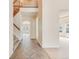 Spacious foyer with tile flooring, a staircase, and open access to the living areas at 18338 E Powers Pl, Centennial, CO 80015