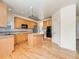 Spacious kitchen with center island, ample cabinetry, stainless appliances, and a built-in oven at 18338 E Powers Pl, Centennial, CO 80015