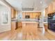 Well-appointed kitchen with stainless appliances, granite countertops, and an island for casual dining at 18338 E Powers Pl, Centennial, CO 80015