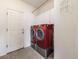 Convenient laundry room features modern washer and dryer units, storage cabinets, and easy access at 18338 E Powers Pl, Centennial, CO 80015