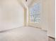 Bright living room with vaulted ceiling and large windows providing ample natural light at 18338 E Powers Pl, Centennial, CO 80015