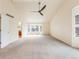 Large living room with cathedral ceiling, ceiling fan, and lots of natural light at 18338 E Powers Pl, Centennial, CO 80015