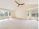 Spacious living room featuring a ceiling fan and windows providing natural light at 18338 E Powers Pl, Centennial, CO 80015