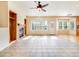 Sun-drenched living room with large windows, fireplace, and tiled floors offer style and comfort at 18338 E Powers Pl, Centennial, CO 80015