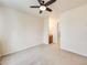 Spacious carpeted main bedroom with ceiling fan and adjoining bathroom vanity at 18338 E Powers Pl, Centennial, CO 80015
