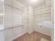 Walk-in closet with a variety of metal shelving on all sides at 18338 E Powers Pl, Centennial, CO 80015
