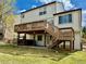 Spacious backyard includes a large deck with stairs, perfect for outdoor entertaining and relaxation at 18145 E Weaver Ave, Aurora, CO 80016