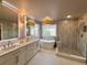 Modern bathroom with dual sinks, separate tub and shower, and plenty of natural light at 18145 E Weaver Ave, Aurora, CO 80016