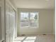 Bright bedroom featuring carpet floors, a large closet and window that provides natural light and an outside view at 18145 E Weaver Ave, Aurora, CO 80016