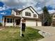 Charming two-story home with a well-manicured lawn and inviting three car garage at 18145 E Weaver Ave, Aurora, CO 80016