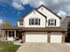 Inviting two-story home with a large driveway and a manicured front yard at 18145 E Weaver Ave, Aurora, CO 80016