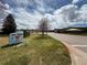 Community area with green lawns, signage and easy access to the main road at 18145 E Weaver Ave, Aurora, CO 80016