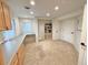 Spacious living room features built-in desk and shelving, perfect for home office or study at 18145 E Weaver Ave, Aurora, CO 80016