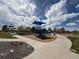 Community playground featuring swings, slides, and play structures for enjoyment at 18145 E Weaver Ave, Aurora, CO 80016