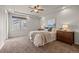 Bright primary bedroom with tray ceiling and large window at 20162 E 53Rd Pl, Denver, CO 80249