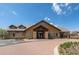 Inviting clubhouse with brick-paved drive, stone accents, and ample windows at 20162 E 53Rd Pl, Denver, CO 80249