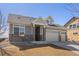 Charming home featuring stone accents, a three-car garage, and well-kept landscaping at 20162 E 53Rd Pl, Denver, CO 80249