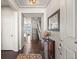 Entryway view showing hardwood floors, a staircase, stylish decor, and an open floor plan at 20162 E 53Rd Pl, Denver, CO 80249