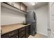 Laundry room with washer, dryer, cabinets and counter space at 20162 E 53Rd Pl, Denver, CO 80249