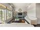 Cozy living room featuring a fireplace, built-in shelving, and comfortable seating for relaxation at 20162 E 53Rd Pl, Denver, CO 80249