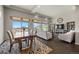 Open-concept dining and living room with hardwood floors, natural light, recessed lighting, and stylish furniture at 20162 E 53Rd Pl, Denver, CO 80249