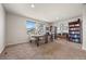 Spacious home office with two desks, bookshelves and large windows at 20162 E 53Rd Pl, Denver, CO 80249