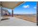 Spacious covered patio with views of an expansive, well-maintained yard and open space at 20162 E 53Rd Pl, Denver, CO 80249