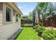 Landscaped backyard featuring green grass and privacy fence, perfect for relaxation or outdoor activities at 1934 S Sherman St, Denver, CO 80210