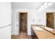 Modern bathroom featuring tiled shower with glass door and vanity with sink at 1934 S Sherman St, Denver, CO 80210