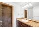 Modern bathroom with tiled shower and vanity with sink at 1934 S Sherman St, Denver, CO 80210