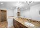 Modern bathroom with dual sinks, granite countertops, a large vanity, and access to the shower and tub at 1934 S Sherman St, Denver, CO 80210