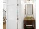 Stylish half bathroom with a vessel sink, decorative mirror, and modern fixtures, creating an elegant space at 1934 S Sherman St, Denver, CO 80210