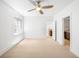 Bedroom featuring a neutral carpet, ensuite bathroom, and a ceiling fan at 1934 S Sherman St, Denver, CO 80210