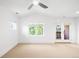 Spacious bedroom with neutral carpet, abundant natural light from the window and access to an outdoor balcony at 1934 S Sherman St, Denver, CO 80210