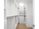 Well-organized walk-in closet with custom shelving, hanging rods, and built-in storage for optimal space utilization at 1934 S Sherman St, Denver, CO 80210