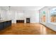 Spacious living area with a fireplace and open kitchen with barstool seating at 1934 S Sherman St, Denver, CO 80210